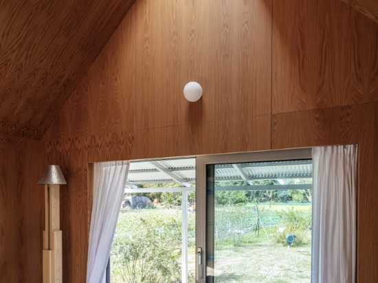 AOA Architects covered the interiors of the homes in wood