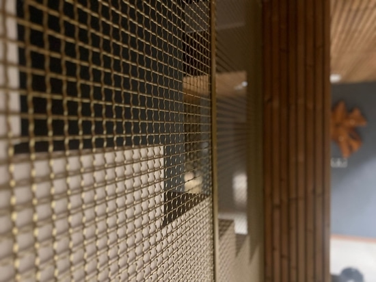 S-40 Woven Wire Mesh in Plated Satin Brass for Staircase Space Divider