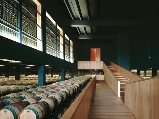 a catwalk guides the visitors through the cask aging area that is a large vacuum, flanked by the bottle aging room