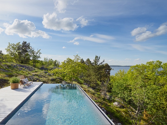 the dwelling looks out over the treetops towards the stockholm archipelago