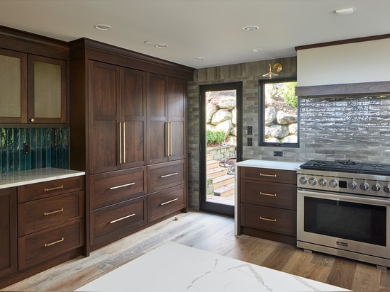 Kitchen remodel installed beautiful new walnut cabinets adorned with Banker Wire’s S-12 woven wire mesh in a plated Antique Brass finish