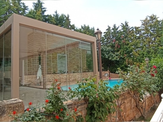 Create an outdoor room with the CospiBio bioclimatic pergola and the CospiEpal sliding glass wall system.