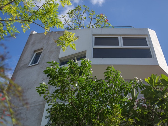 Several levels of tiered open spaces are found inside this new house in Singapore