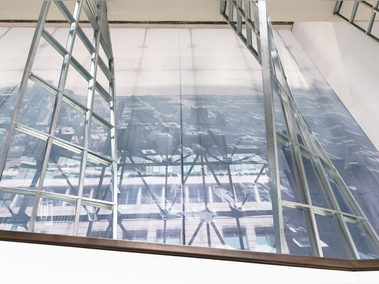 SO-IL uses steel studs to create a latticed archway inside Chicago Biennial headquarters