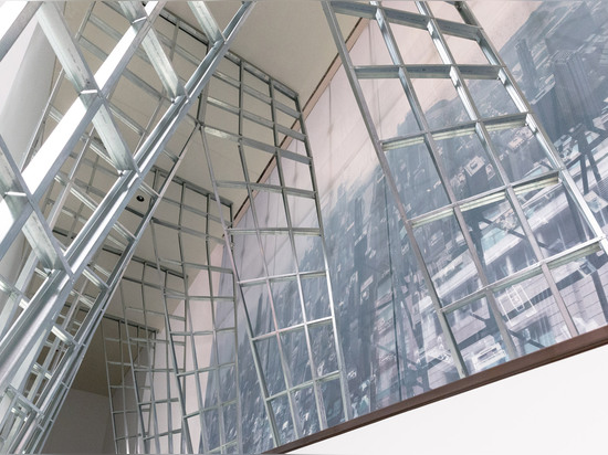 SO-IL uses steel studs to create a latticed archway inside Chicago Biennial headquarters