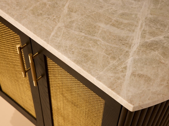 The Seaholm Cocktail Bar features Banker S-32 woven wire mesh in brass to match the cabinet's dark hardwood oak.