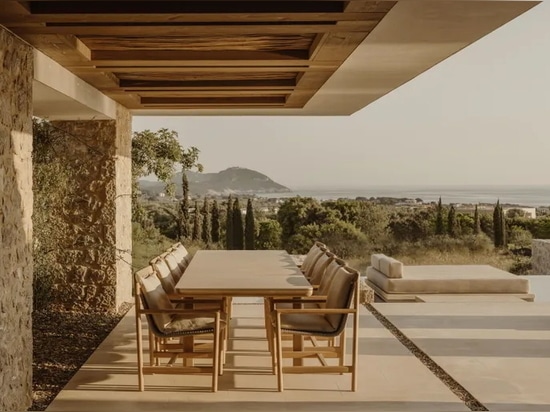 A Costa Navarino house peeks out from amidst olive groves to ocean views
