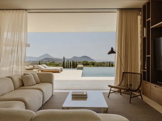 A Costa Navarino house peeks out from amidst olive groves to ocean views