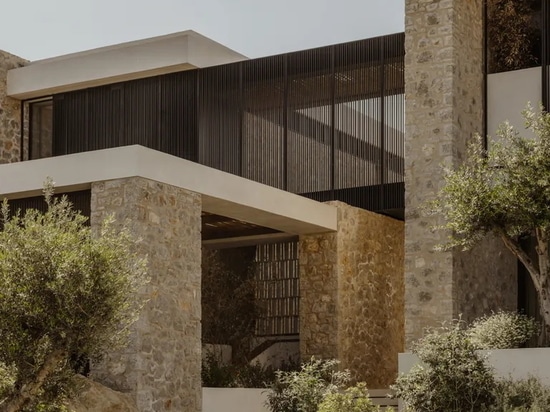 A Costa Navarino house peeks out from amidst olive groves to ocean views