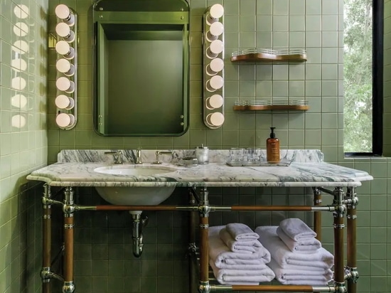 The 71 guest rooms and suites feature marble-floored bathrooms and warm color palettes.