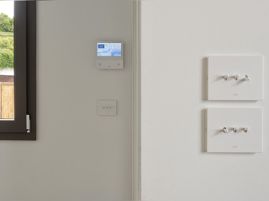 Toggle controls and Wi-Fi video intercom by AVE for a contemporary-style villa