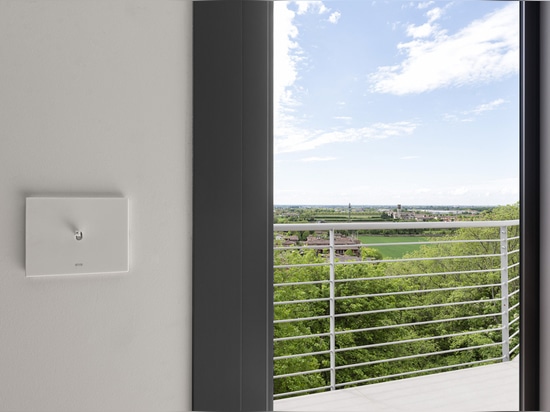 Toggle controls and Wi-Fi video intercom by AVE for a contemporary-style villa