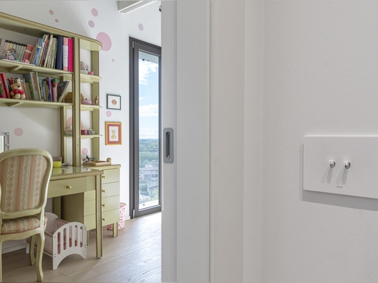 Toggle controls and Wi-Fi video intercom by AVE for a contemporary-style villa
