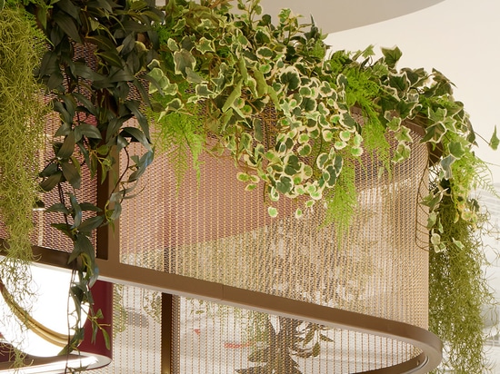 Sancroft Building showcasing modern architecture with abundant natural light, contemporary furnishings, and distinctive design elements such as  woven wire mesh from Banker Wire
