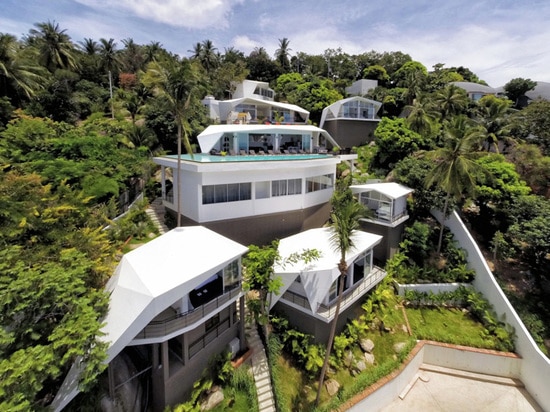 A new resort lives on a hillside among the trees in Thailand