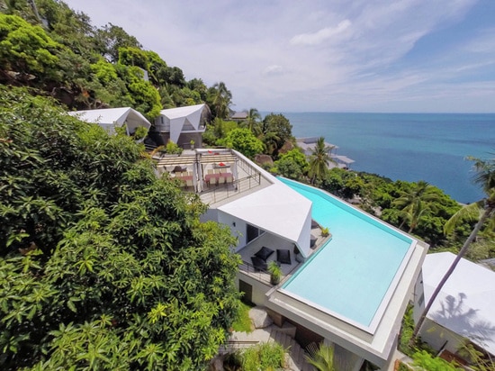 A new resort lives on a hillside among the trees in Thailand