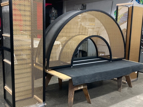 Curved bronze mesh archway designed and fabricated by Desposito Designs for the Ace Porter bar in the Omni San Diego