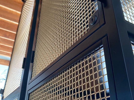 Close-up of L-441 architectural wire mesh woven in bare bronze at Ace Porter bar