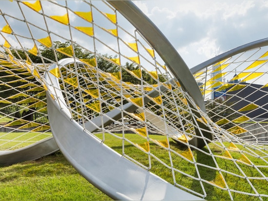 A twisted trefoil knot sculpture has arrived in this urban park