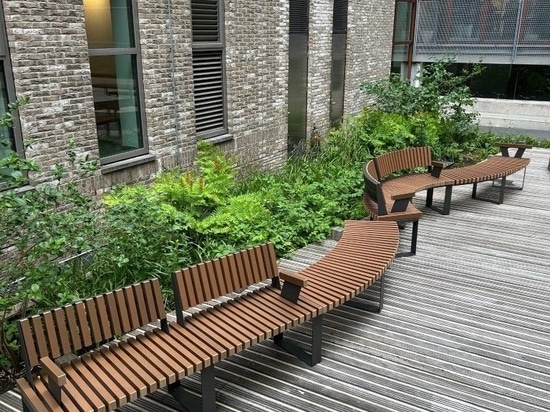 Málaga bench with WPC (Wood Plastic Composite) synthetic wood slats in the courtyard of the World Trade Centre in the Netherlands.