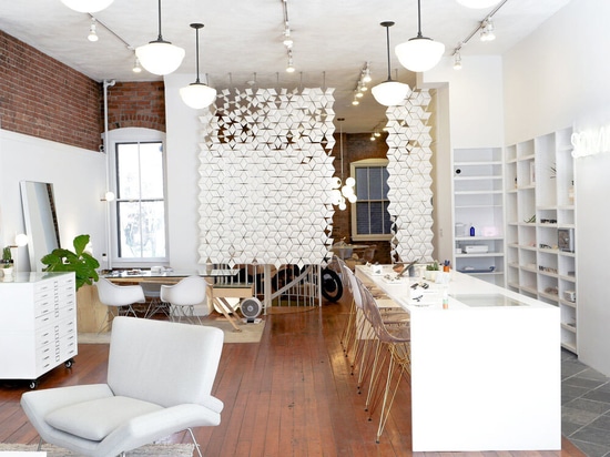 The spacious store is stylishly divided with two Facet room dividers