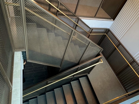 New York Stairwell Design Showcasing Woven Wire Mesh Elegance