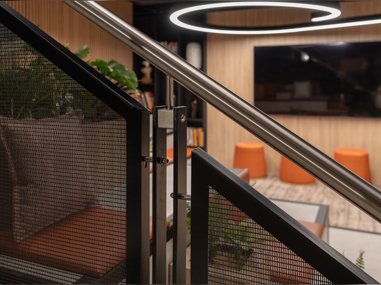 Banker LPZ-71 architectural wire mesh enhances staircase design with clean lines, durable materials, & a contemporary look ideal for residential & commercial spaces.