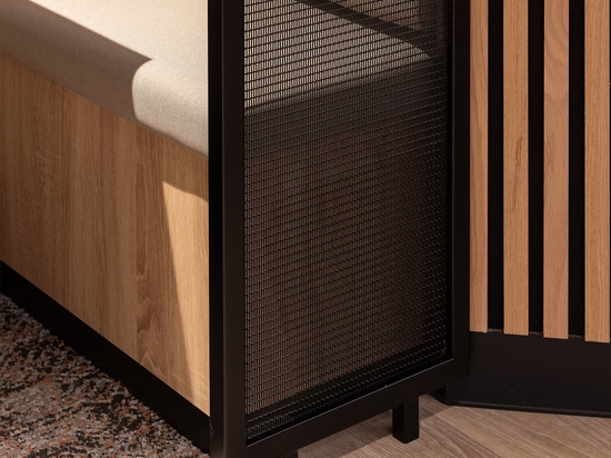 Woven wire mesh space dividers in Banker LPZ-71 create semi‑private seating booths at 58 Mosley Street, adding to the collaborative workplace atmosphere.
