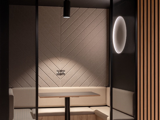 Woven wire mesh space dividers in Banker LPZ-71 create semi‑private seating booths at 58 Mosley Street, adding to the collaborative workplace atmosphere.