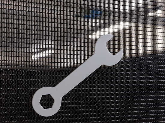 The secure bike storage area uses durable LPZ-71 woven wire mesh panels to provide visibility, ventilation, and long‑lasting protection.