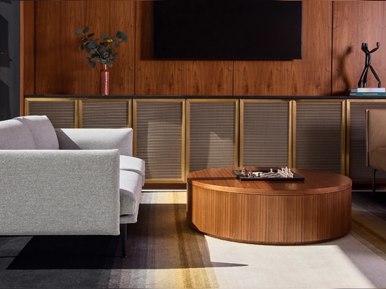 Decorative woven wire mesh installed in corporate interior design as cabinet infill panels
