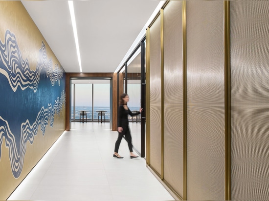 Decorative woven wire mesh IPZ-25 installed in corporate interior design as a space divider.