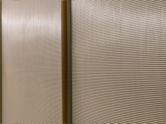 Decorative woven wire mesh IPZ-25 installed in corporate interior design as a space divider.