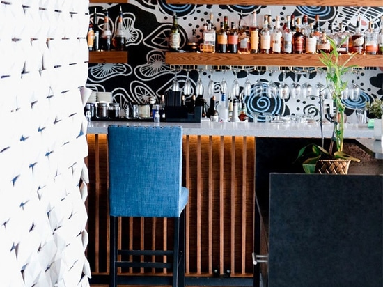 White Facet Room Divider Enhances Restaurant Ambiance