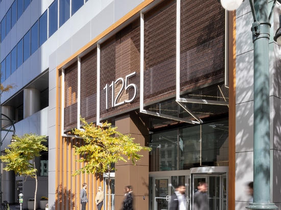 Dune 40100 flexible wire mesh continues the textured design element  from the exterior facade into the welcoming space of the lobby