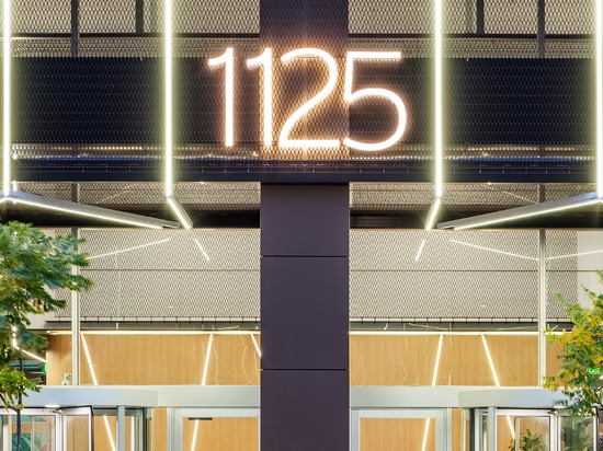 Dune 40100 flexible wire mesh continues the textured design element  from the exterior facade into the welcoming space of the lobby