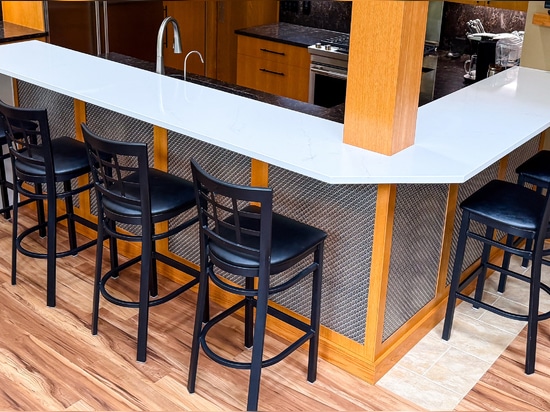 Discover how Banker Wire's M33-2 woven wire mesh adds texture, depth, and sophistication to this custom home bar remodel, creating a striking architectural focal point.