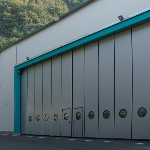 スライド式産業ドア - LE, LN, LG, SN, BT series - SILVELOX GROUP SPA - 折りたたみ式 / 金属板 / ポリウレタン製