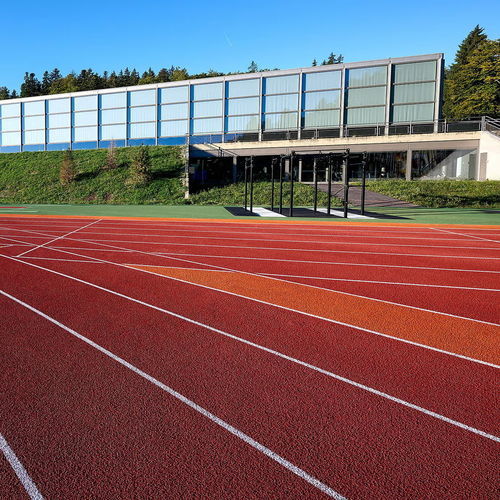 屋外用スポーツ施設用床材 - RE-TOPPING SYSTEMS - Polytan GmbH - エラストマー / ゴム製 / 学校用