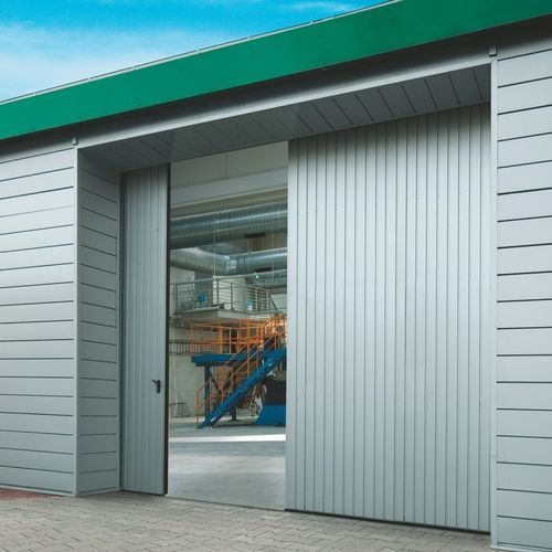 Porta industrial de correr - WISNIOWSKI - em chapa de aço / grande abertura / com isolamento térmico