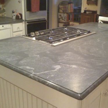 Tampo de bancada em granito - VIRGINA MIST - WALL GRANITE SERVICE SRL - para cozinha / preto / de borda arredondada
