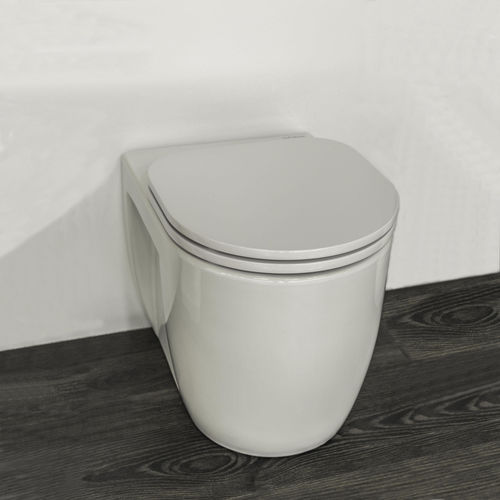 Vaso sanitário suspenso - JUNIOR - Valadares - em cerâmica / em aço inoxidável / moderno