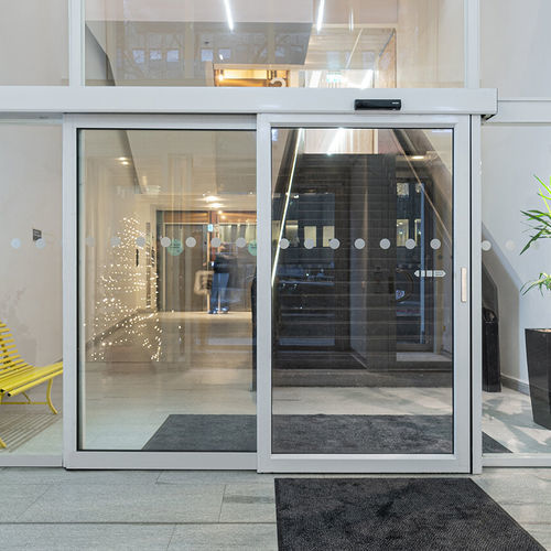 Sistema deslizante em alumínio - SL521 Telescopic - ASSA ABLOY Entrance Systems - para porta de vidro / com corrediças ocultas / da linha comercial