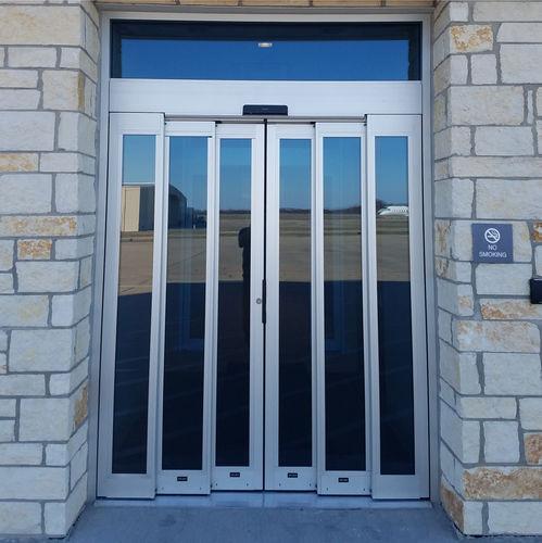 Sistema deslizante metálico - SL500 T67 - ASSA ABLOY Entrance Systems - para porta de vidro / com corrediças ocultas / para edifício de uso público