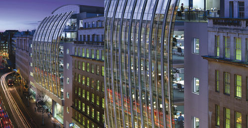 Fachada-cortina com sistema stick - HIGH HOLBORN - Permasteelisa - em vidro / em aço inoxidável
