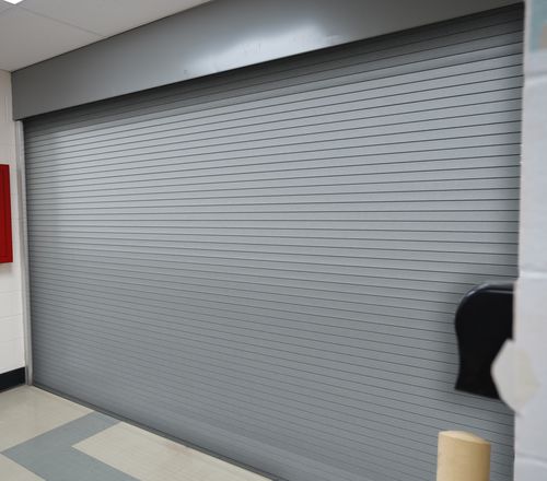 Porta industrial em aço galvanizado - CROSSINGGARD® & THREATPROTECT™ - Cornell - de enrolar / em alumínio anodizado / em alumínio extrudado