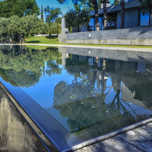 Piscina pré-fabricada - Steel And Style - com transbordo / corredor de natação / sob medida