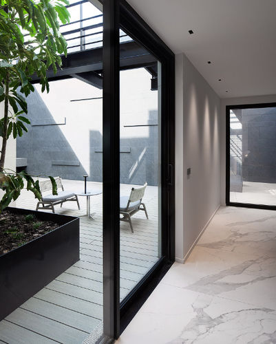Revestimento de fachada em painéis - LAMINAM - em pedra / vertical / aveludado