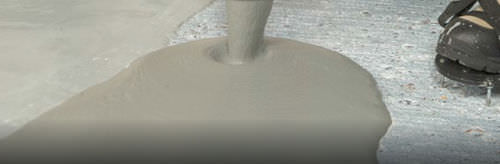 Revestimento de piso em concreto - FLOWTOP™ - Watco Industrial Flooring - liso / efeito de concreto / antiderrapante