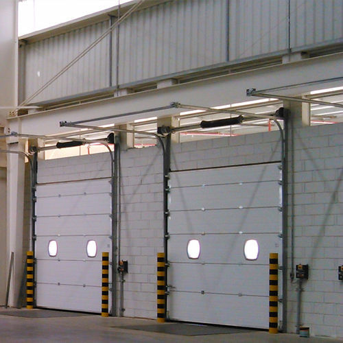 Porta industrial seccionada - SEMI-VERTICAL LINTEL - KOPRON - metálica / automática / com isolamento térmico